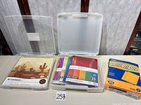 Overall lot with two storage cases, paper packs and Quill Brights box