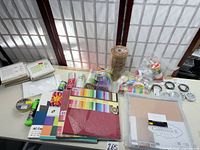 Overview of cardstock pads, ribbons, tapes, mason jar lids