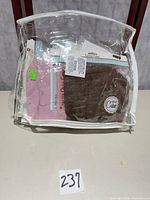 Clear zip bag holding multiple packaged covers