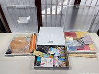 All three storage cases opened showing contents