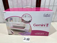 Front of retail box showing Gemini II branding and machine image