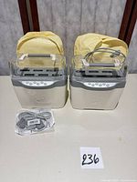 Two Cricut Jukebox units with cables displayed