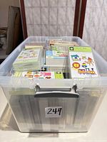 Clear tote filled with sealed Cricut cartridges