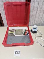 Heat press, base, mat inside red case