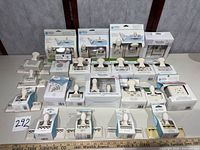 Full lot showing 24 boxed Martha Stewart punches arranged on table