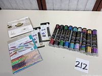 All 14 foil transfer items laid out on table