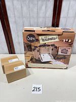 Box showing Sizzix Vagabond 2 graphics next to two pad boxes