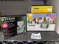 All boxed components: machine box, two refill cartridge boxes visible