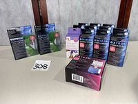 Group shot of all Xyron items: two green sticker makers, multiple 1.5 in refills, one 2 in refill