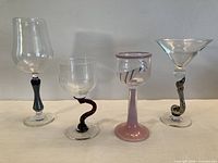 Front view of all four art glass goblets