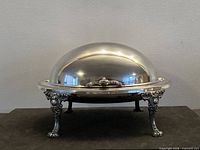 Front view of closed dome tureen on ornate legs