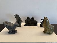 Group shot of all five stone carvings