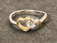 Full view of two-tone gold heart diamond ring