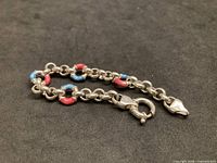 Full view of sterling silver bracelet with enamel links