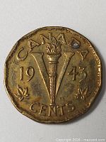 Reverse of 1943 Canada 5 Cents coin showing torch V design and date