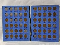 Folder opened showing both pages of coins and empty slots