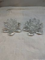 Both crystal glass lotus candle holders side by side