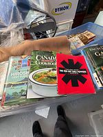 Stack with Canada Cookbook, Red Hot Chili Peppers book, Hiroshige art book, Encyclopedia of Gardening