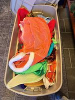 Top view of bin showing multiple costume pieces