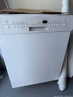 Front view of dishwasher with control panel