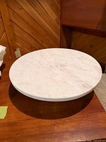 Top view of round white marble cake stand