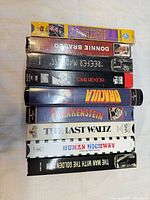 Stack of all nine VHS tapes showing spines