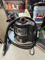 Overall view of Rainbow E2 canister with hose and dusting brush