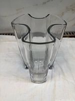 Top view of clear glass vase showing undulating rim and thick walls