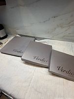 Three Verdici boxes closed