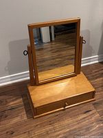 Front view showing mirror, base and overall appearance