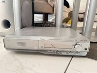 Front of slim JVC AV receiver/DVD player with control buttons