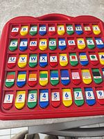 Front view showing all flip tabs for alphabet, numbers, colours