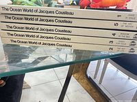 Stacked spines showing all five volumes with titles and numbers