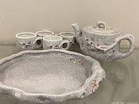 entire tea set showing teapot, cups and tray