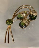 Front view showing overall brooch design and stones