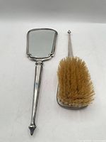 Hand mirror and hairbrush full view