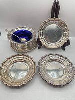 Complete set showing bowl with liner and spoon plus plates