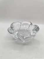 Oblique view of clear crystal lotus-shaped bowl