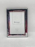 Front view of silver-plated Beltrami frame with opening for 4x6 photo