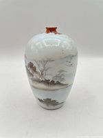 front view of vase showing landscape decoration and form