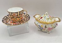 Teacup, saucer and covered sugar bowl side by side