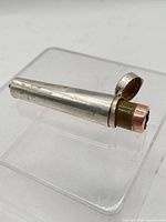 Cheroot holder inside sterling case with lid open