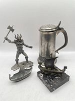 Group shot of tankard, figurine, ship dish and ship sculpture