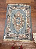 Full view of Persian rug displaying overall pattern, fringe and scale