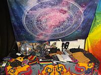 overall lot with tapestry backdrop, disco ball, hats, purses