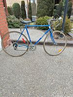 Full side view of blue Venture Lemans bicycle showing entire frame, wheels and components