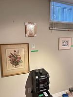 Two framed prints: small still life above larger botanical bouquet