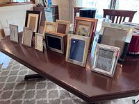 Group shot of all frames on dining table