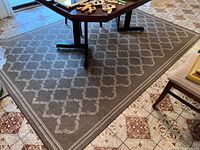 Full view of rug under table showing pattern and overall size