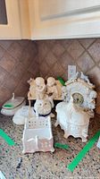 Group view of all porcelain pieces on countertop